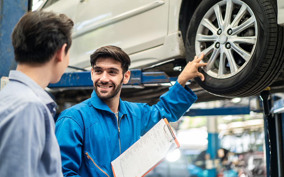Honda certified service technician showing the vehicle owner the work to be performed.